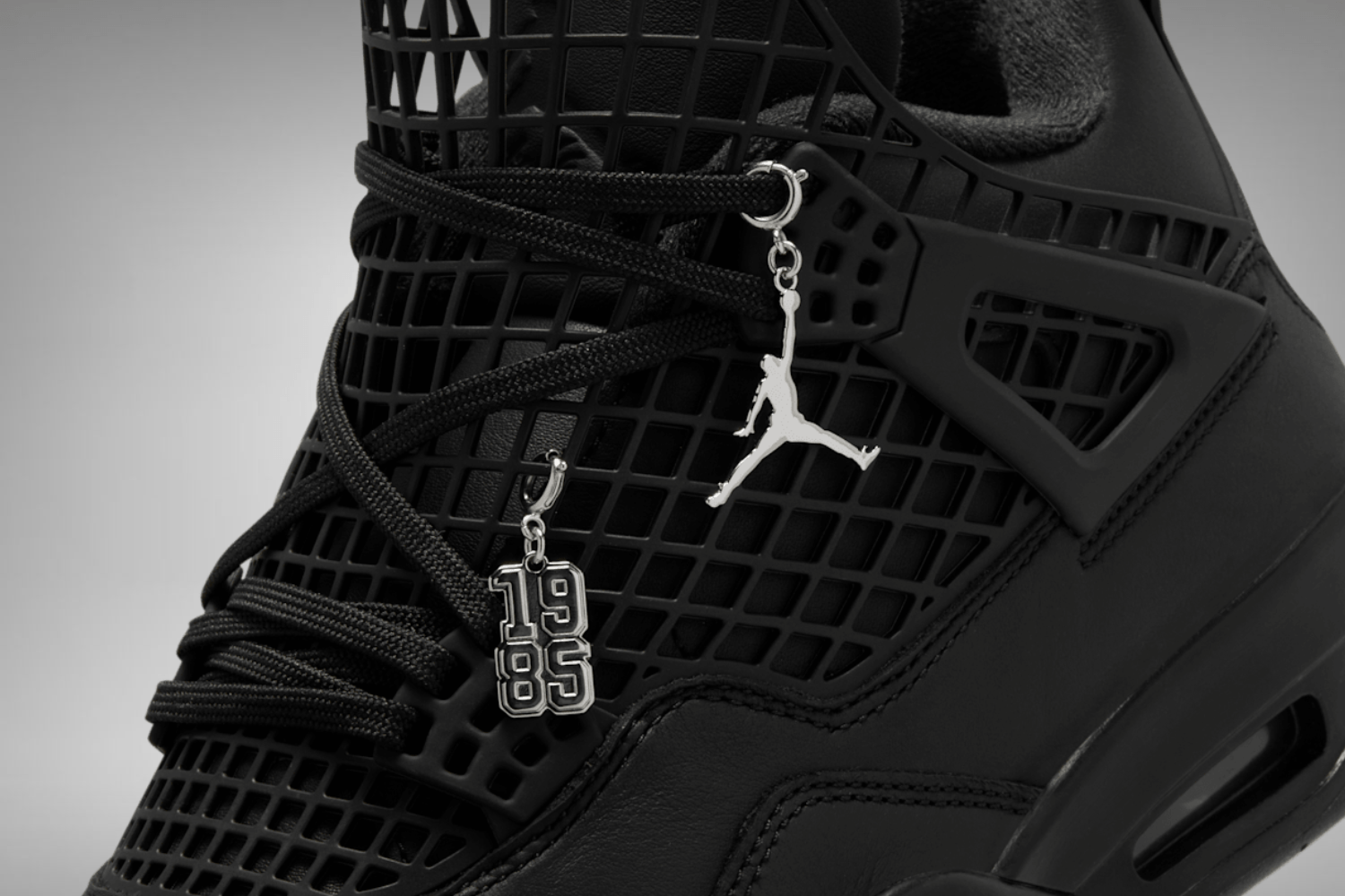 The Air Jordan 4 NET WMNS arrives in a 'Black Cat' colorway