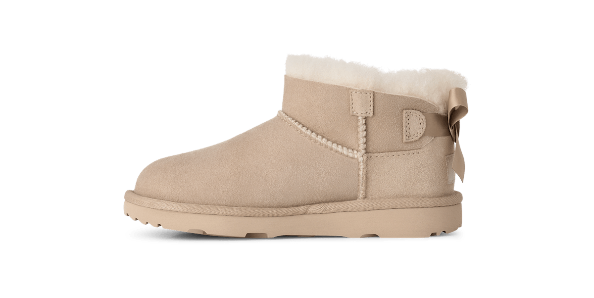 UGG® Ultra Mini Bailey Bow Boot 'Sand' 1185920K-SAN