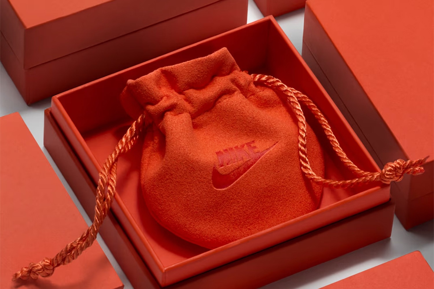 Nike puts the Swoosh on hoops and necklaces