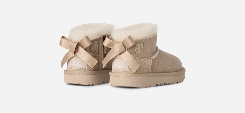 UGG® Ultra Mini Bailey Bow Boot 'Sand'