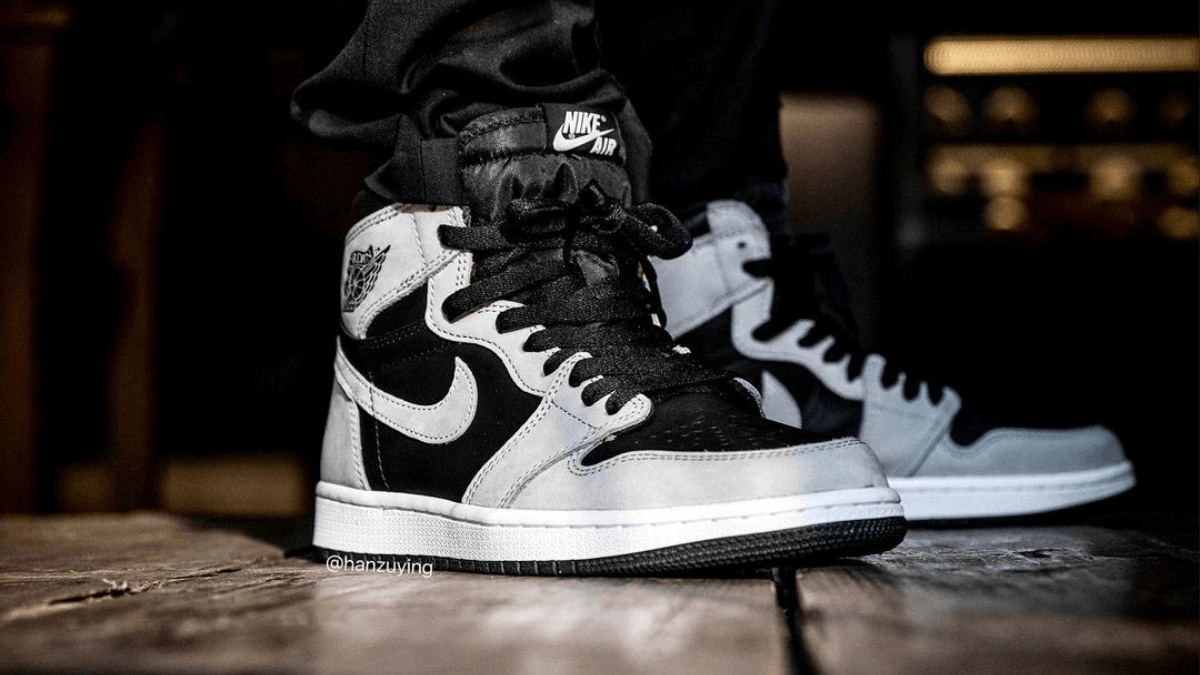 The Air Jordan 1 Retro High OG appears in a 'Shadow 2.0' colorway
