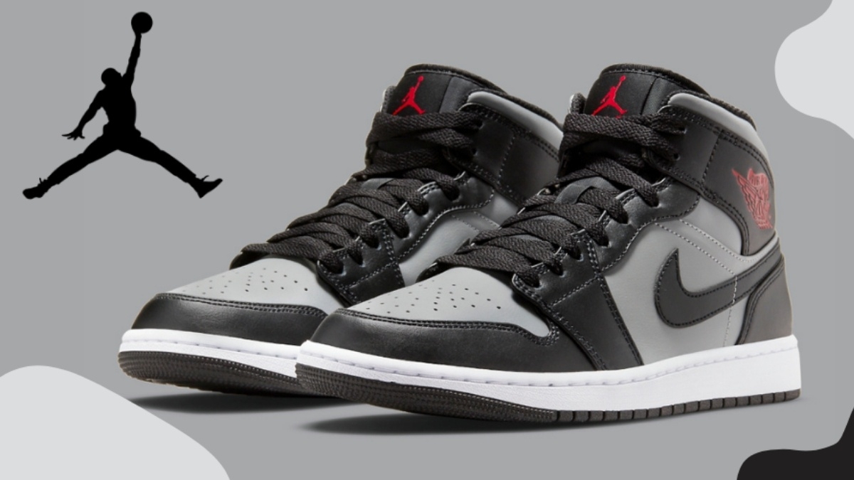 The Air Jordan 1 Mid 'Grey/Black/Red' features an eye-catching detail