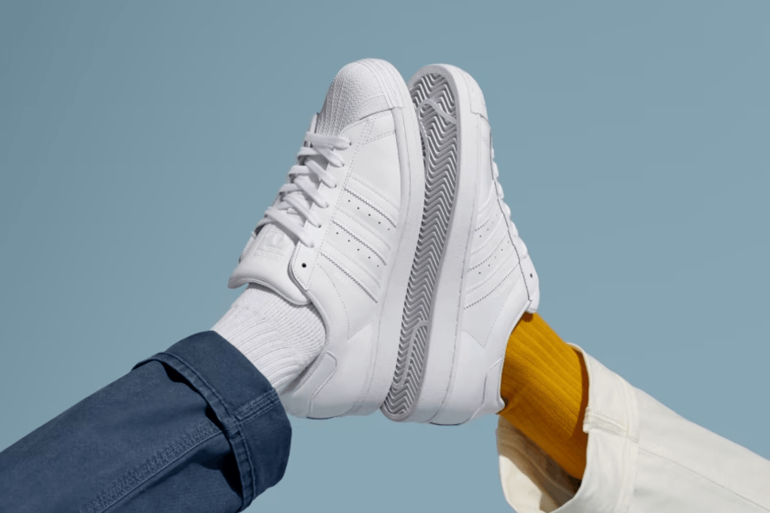 Embrace timeless style with these white sneakers from adidas