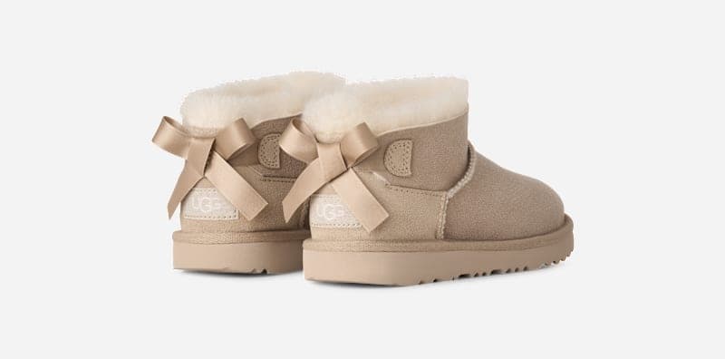 UGG® Ultra Mini Bailey Bow Boot 'Sand'