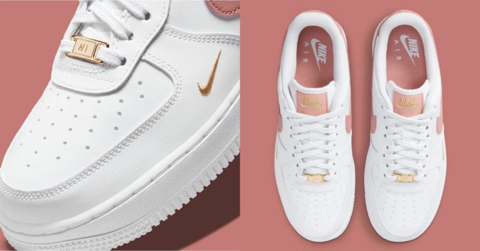 De Nike Air Force 1 Low heeft een elegante look door de White/Rust Pink colorway en details